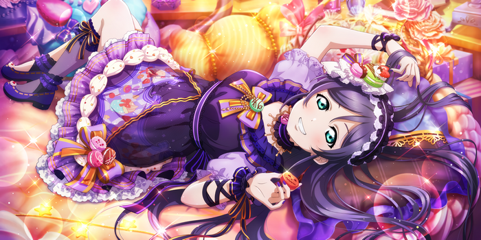 Toujou Nozomi in a Halloween costume surrounded by sweets