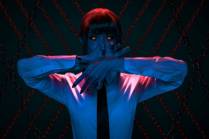 Makima from Chainsaw Man with glowing eyes and chains