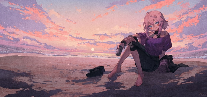 Girl with glasses sitting on a beach at sunset
