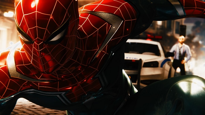 Spider-Man in his suit with a police car in the background