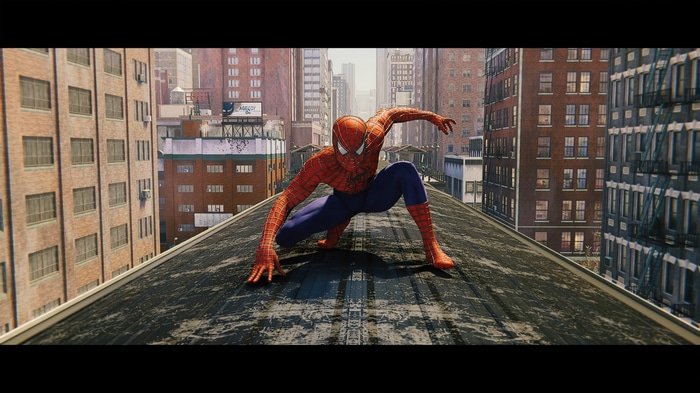 Spider-Man crouches on a rooftop in New York City