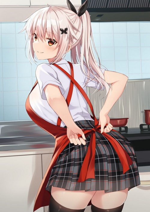 Girl in apron tying a bow