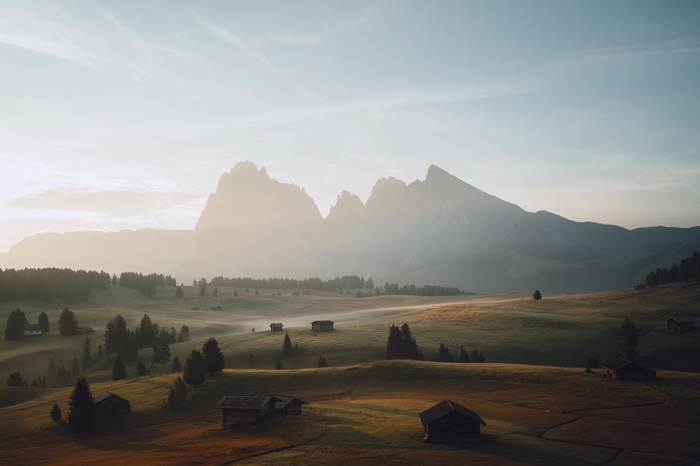 4K misty mountain landscape with cabins