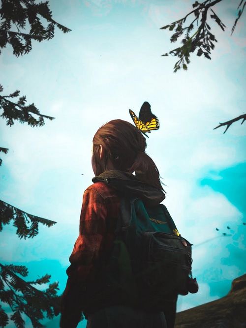 Ellie Williams with a butterfly in The Last of Us