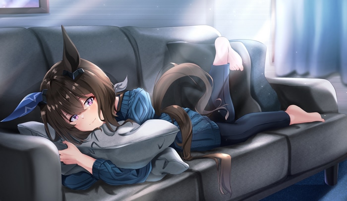 Admire Vega relaxing on a couch