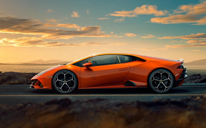 Orange Lamborghini Huracan parked on a road