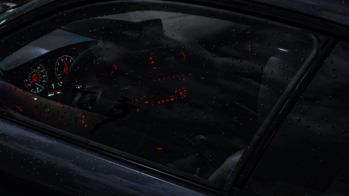 Car interior with dashboard and raindrops on window