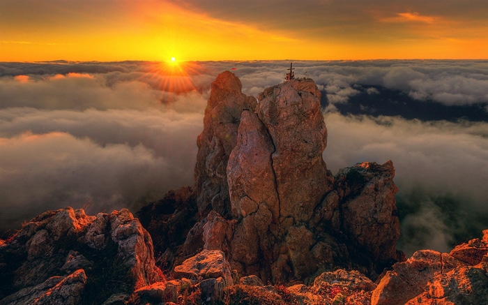 Sunset over the clouds from Ai-Petri mountain in Crimea
