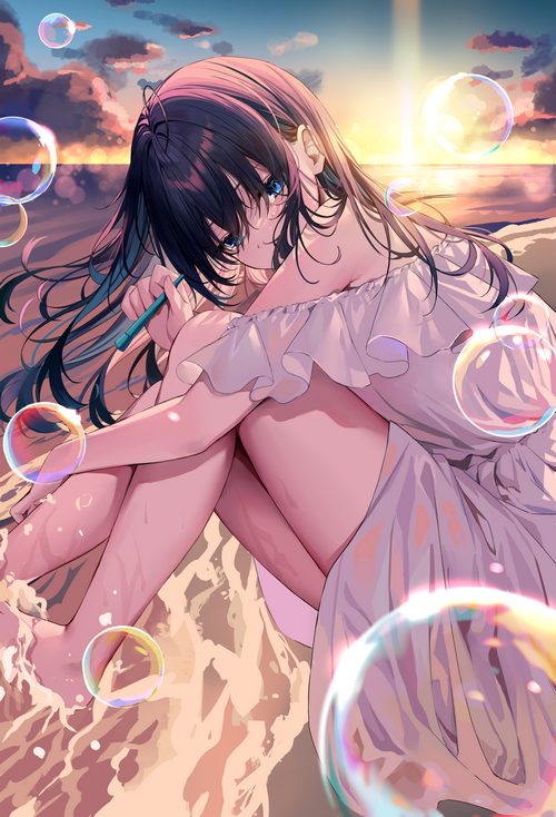 Girl blowing bubbles at sunset on the beach