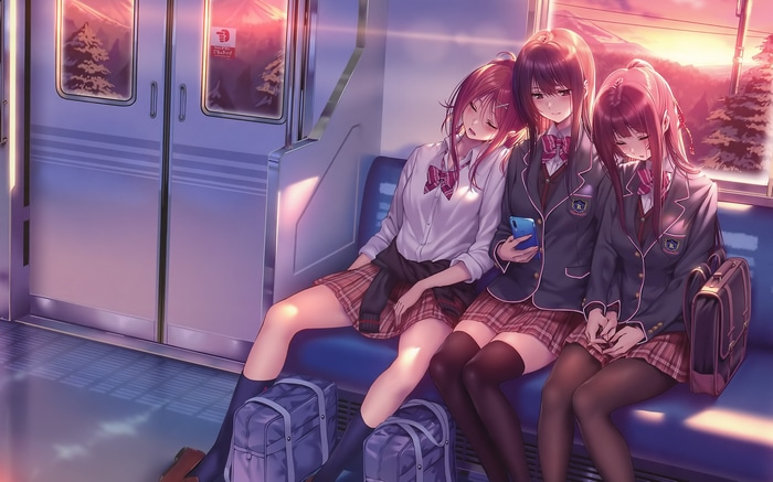 Three schoolgirls in uniform on a train