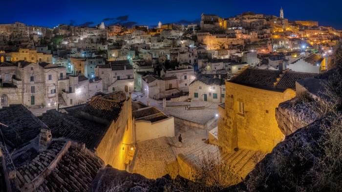 4K night view of Matera, Italy with illuminated buildings