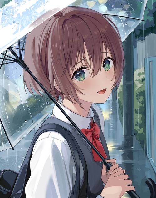Schoolgirl with umbrella in the rain