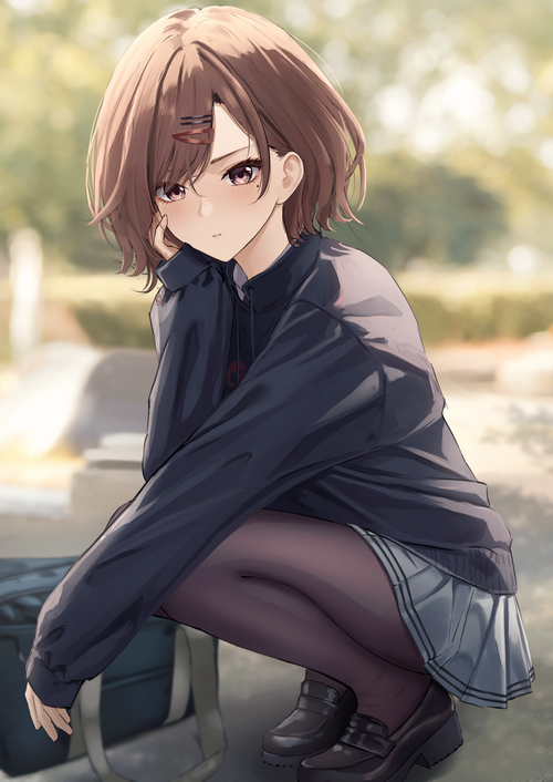 Schoolgirl squatting with a bag