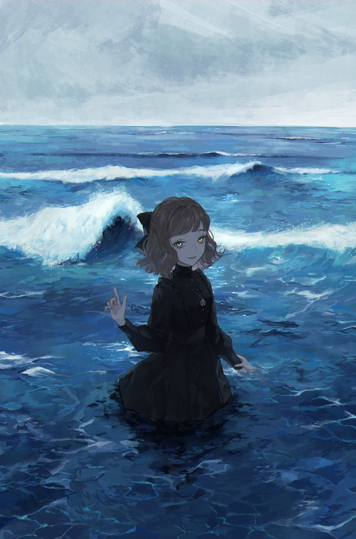Girl in black dress standing in the sea