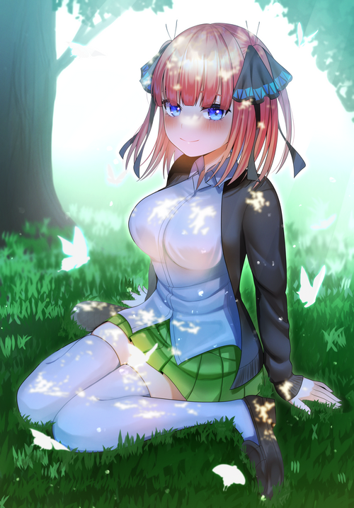 Nino Nakano sitting in a grassy field with butterflies