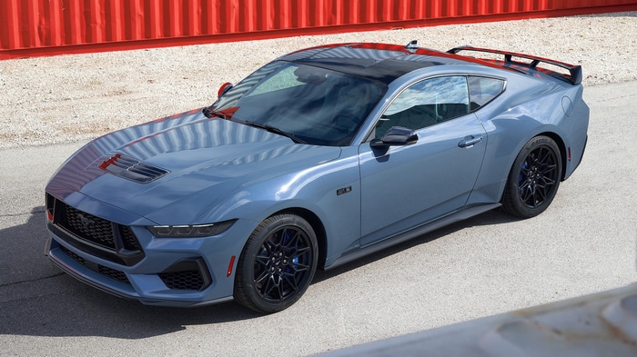 Blue Ford Mustang Dark Horse parked outdoors