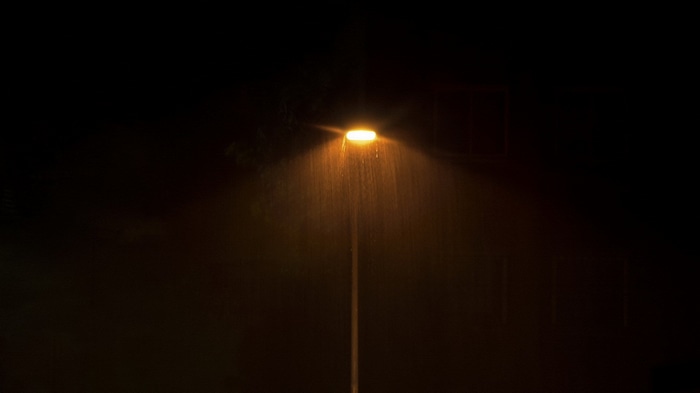 Street lamp in the rain at night