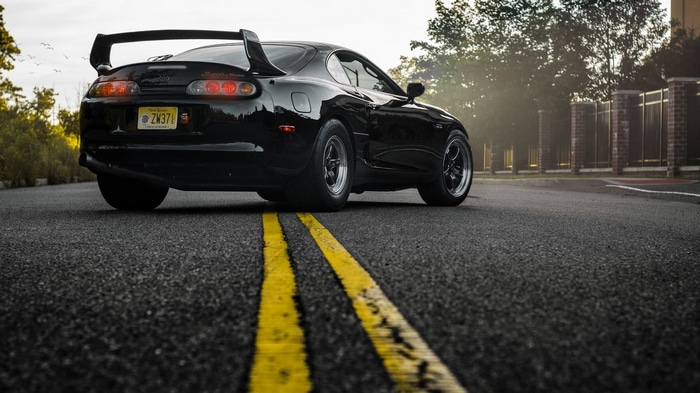 Black Toyota Supra with WELD Racing Rims on Road