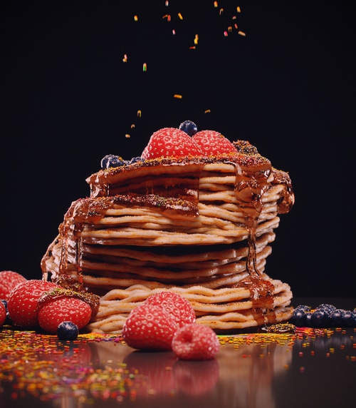 Stack of Pancakes with Berries and Chocolate Drizzle