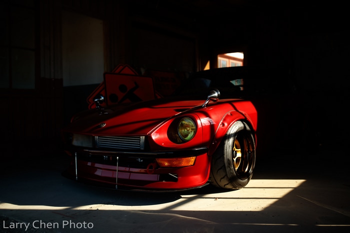 Red Nissan S30 sports car in garage