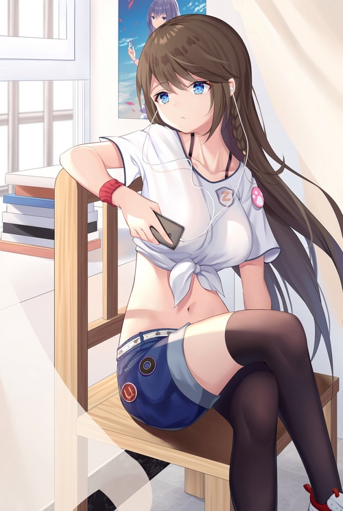 Girl with headphones and phone sitting on a chair