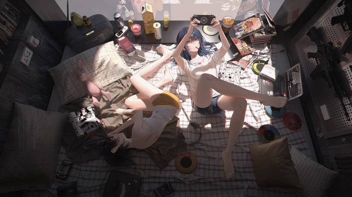 Two girls in a messy room with manga and teddy bears