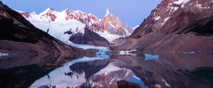 4K snow-capped mountains reflected in a lake