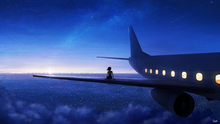 4K aircraft flying over a city at night