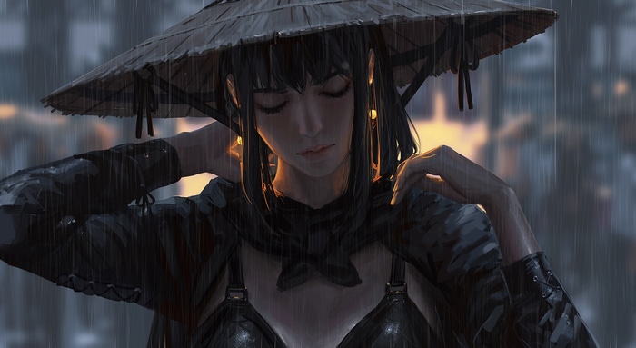 Woman in straw hat in the rain