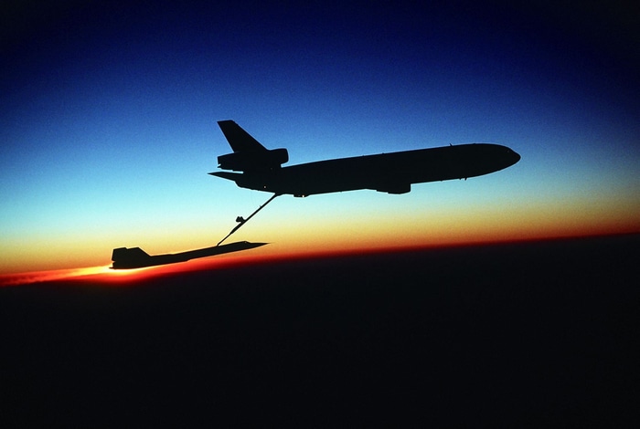McDonnell Douglas KC-10 Extender refuels Lockheed SR-71 Blackbird at sunset