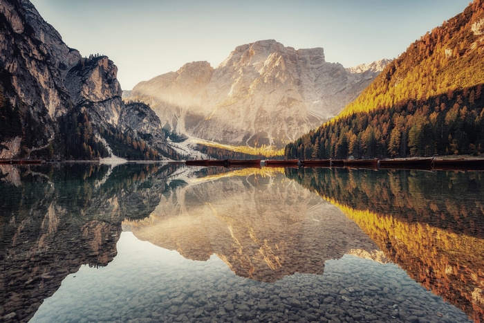 Lake Braies with mountains and boats in autumn