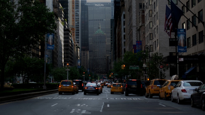 New York City street with taxis and skyscrapers