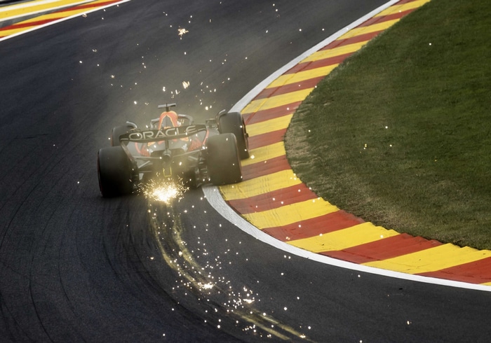 Max Verstappen's Red Bull Racing car sparks on track