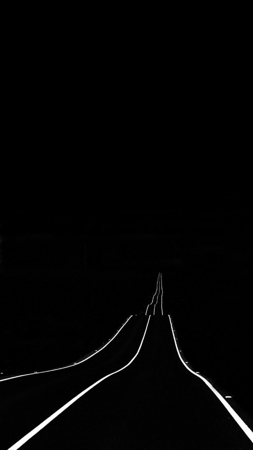 Minimalist night road with white lines