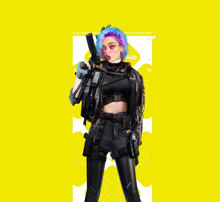Woman with pink and blue hair holding a gun