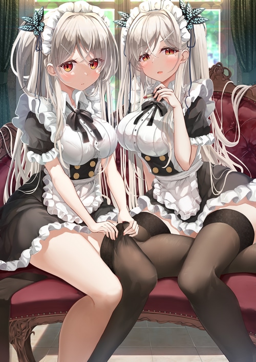 Two maids in maid outfits sitting on a couch
