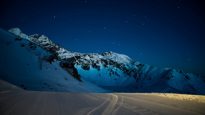 4K Snowy Mountains Under a Starry Night Sky
