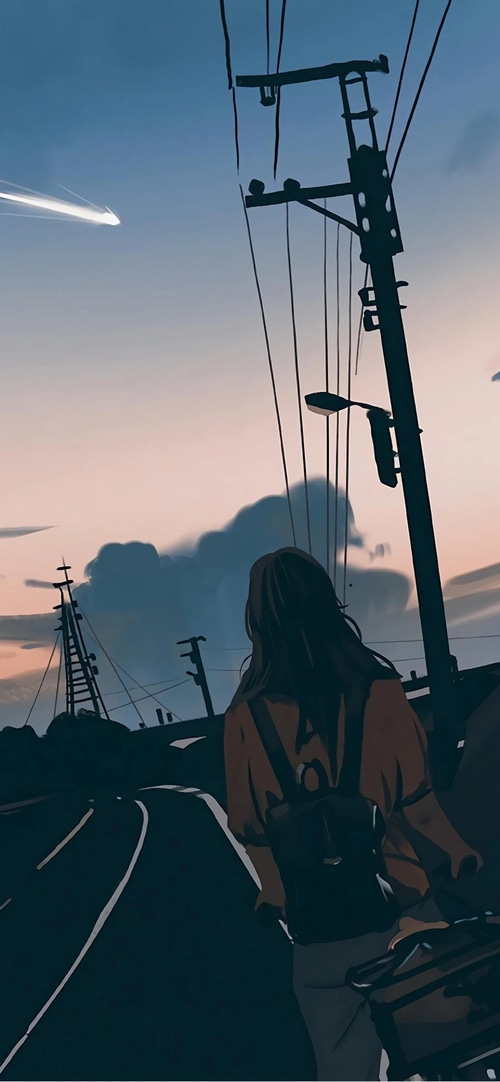 Girl with backpack on a road at dusk