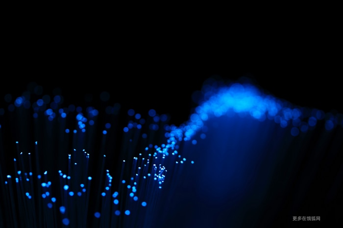 Abstract blue fiber optics on black background