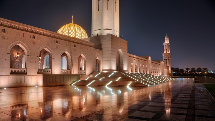 Sultan Qaboos Grand Mosque at night in Muscat, Oman