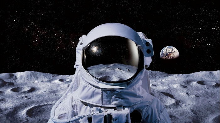 Astronaut on the Moon with Earth in the Background