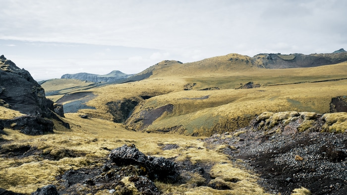 Icelandic landscape with rolling hills and rock formations