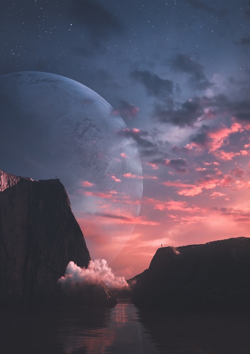 Planet over mountains at sunset with clouds