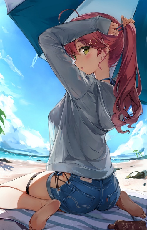 Girl with ponytail and green eyes on the beach