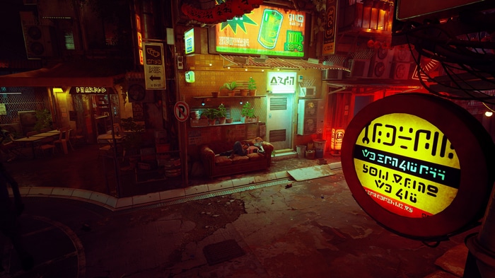Stray: Cat sleeps on couch in neon-lit city alley