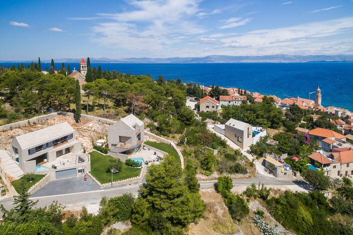 Modern houses with ocean view on a hillside