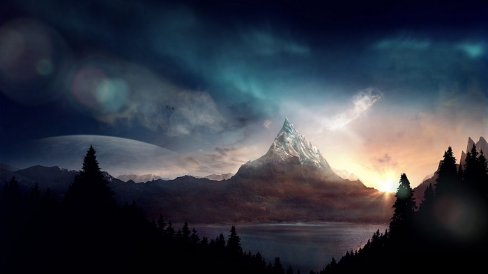 Mountain peak with lake and trees at sunset