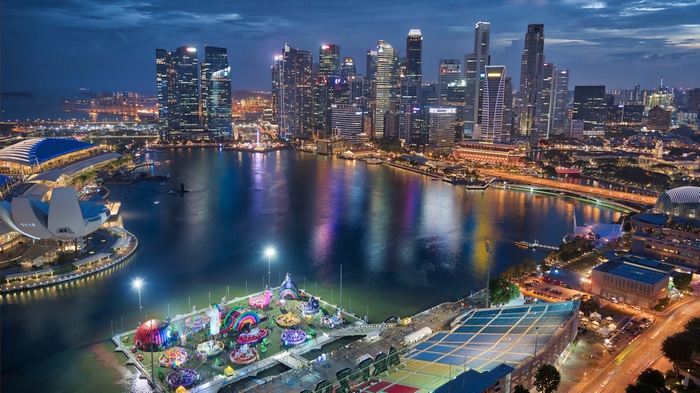 4K Singapore cityscape with skyscrapers and water at night