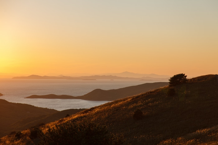 Sunset over the sea and hills