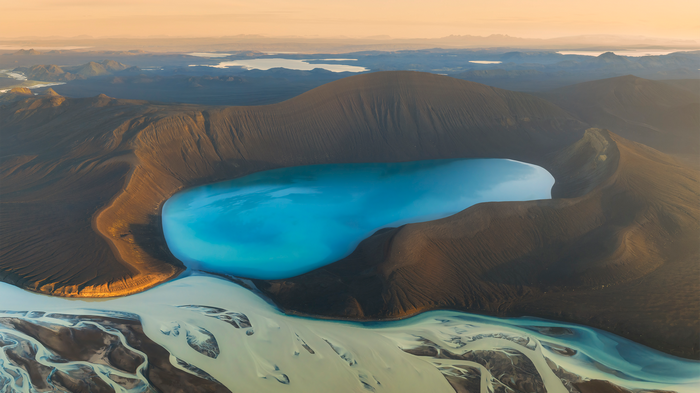 Aerial view of a blue lake in Iceland with river delta